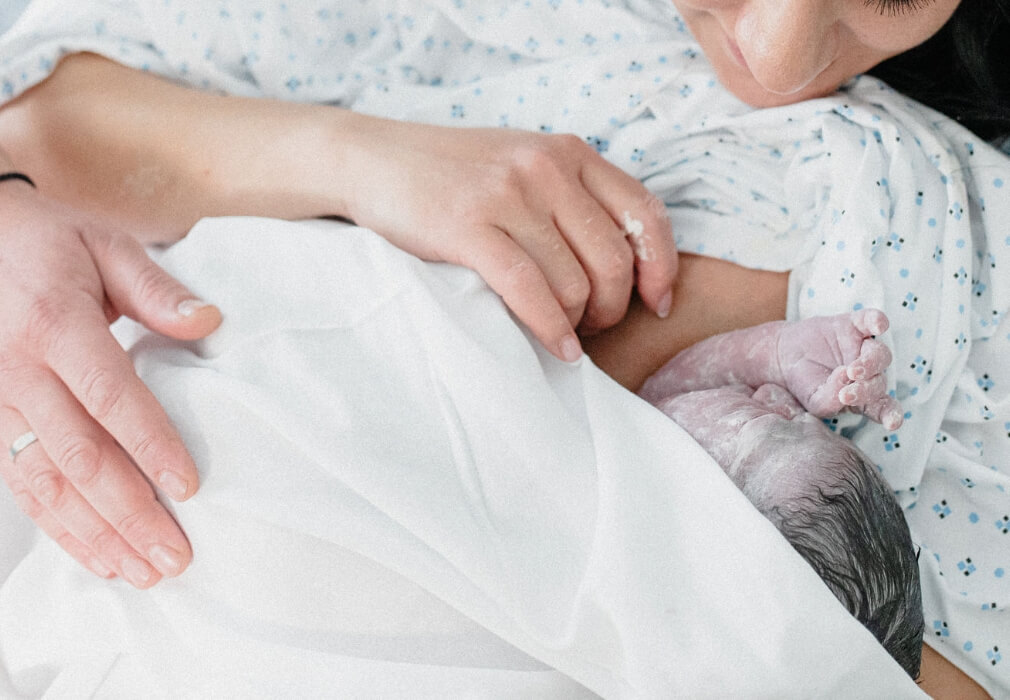 newborn baby with mum